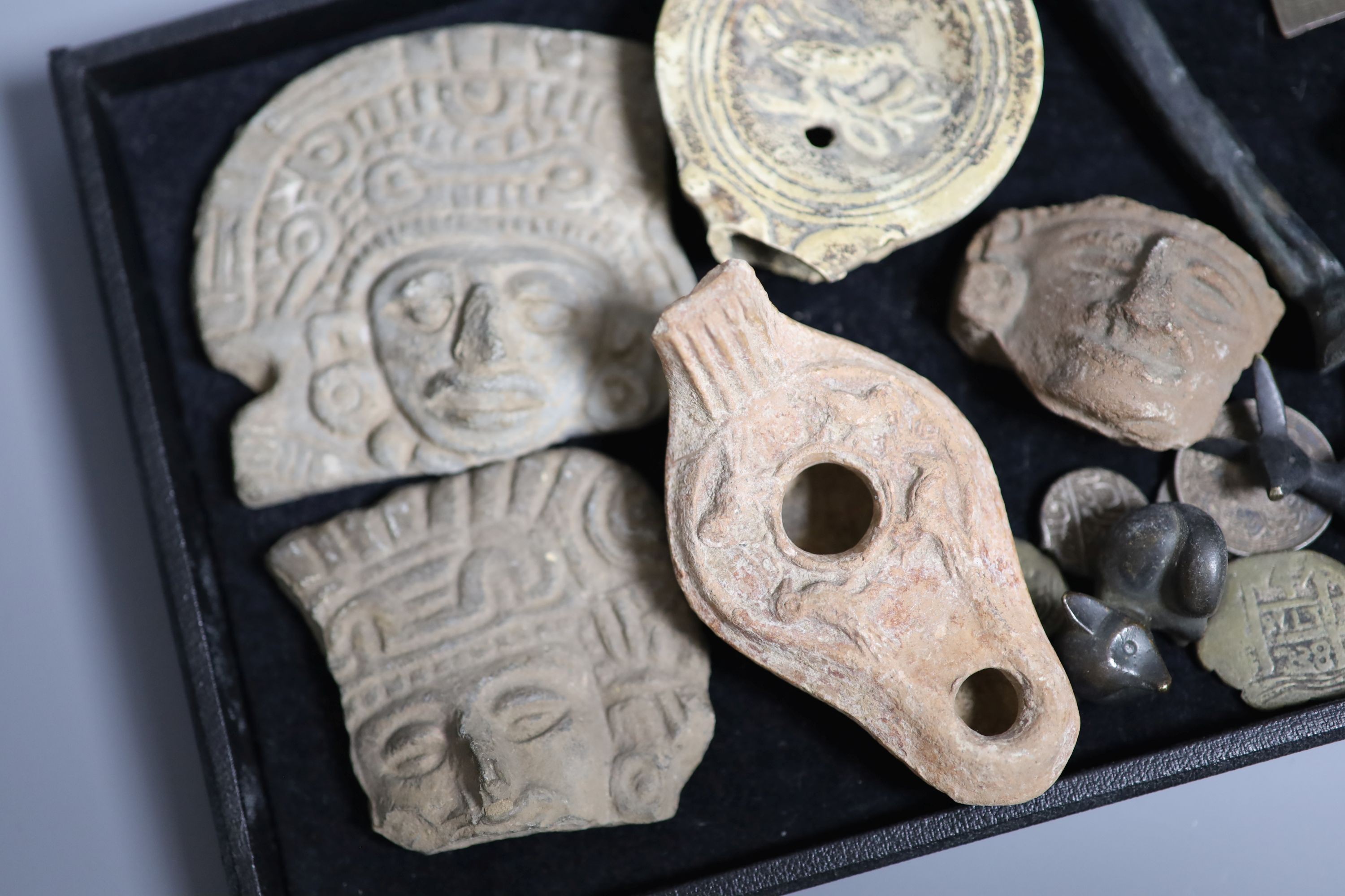 A group of curios including three pre-Columbian pottery fragments, Islamic coins and amulets, etc